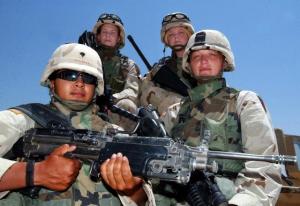 Lionesses Cynthia Espinoza, Ranie Ruthig, Shannon Morgan, and Michelle Perry in Ramadi, Iraq in July 2004. Photograph by Lloyd Francis Jr.